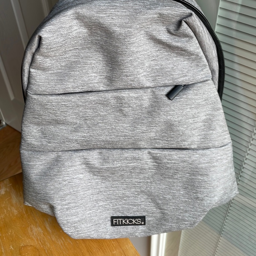 FitKicks sling bag, NWOT backpack, with 7 inch padded tablet pocket